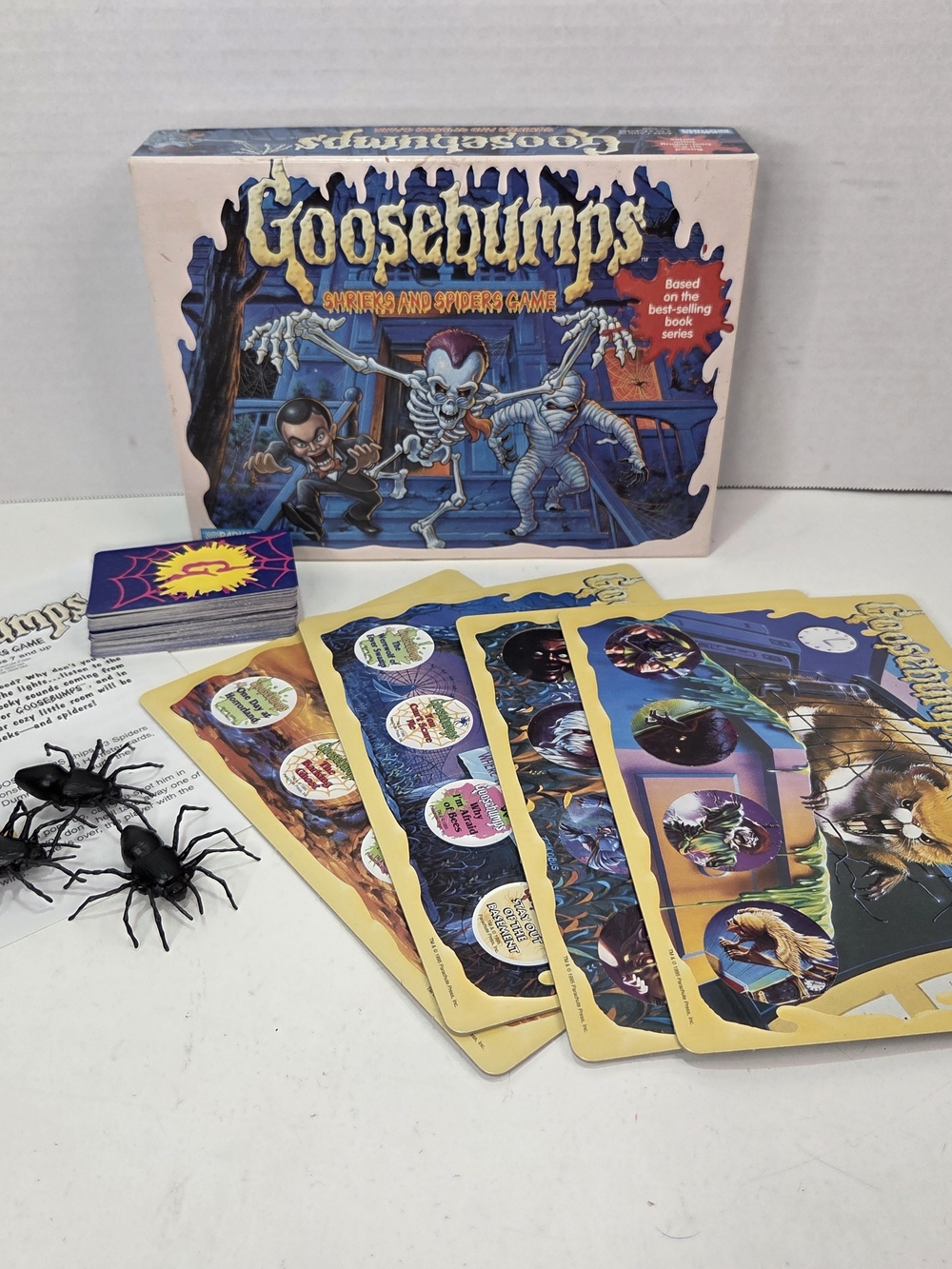 Scholastic Goosebumps Game Box with Yellow Game Boards and Black Plastic Spiders